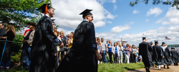 graduates walking at ceremony