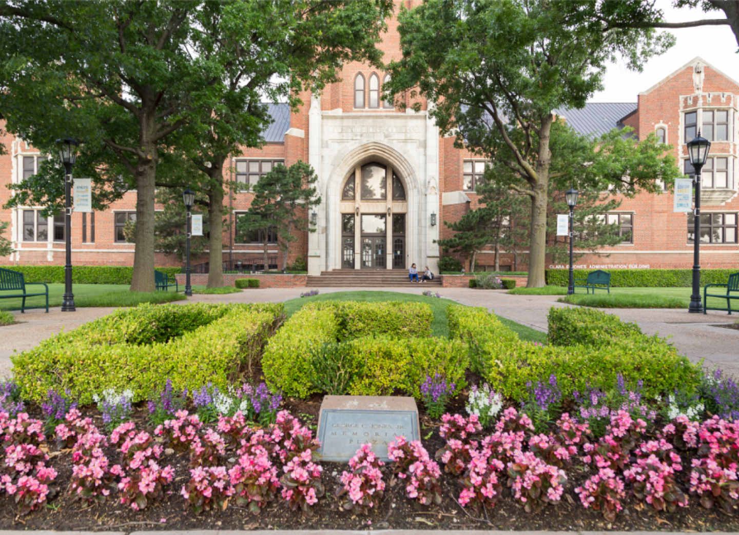 Exterior of building on Oklahoma City University campus, with OCU written in flowers