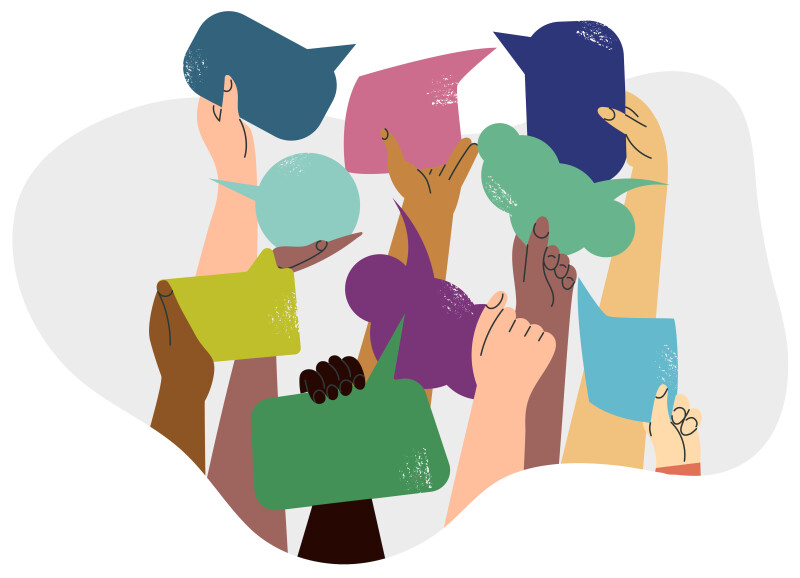 A group of diverse people holding up message bubbles.