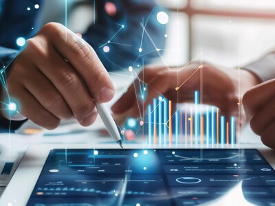 Professionals explore complex data analytics displayed on digital tablet, highlighting modern business strategy and decision-making.