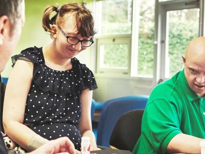 Teachers in a classroom supporting disabled students with transition planning.