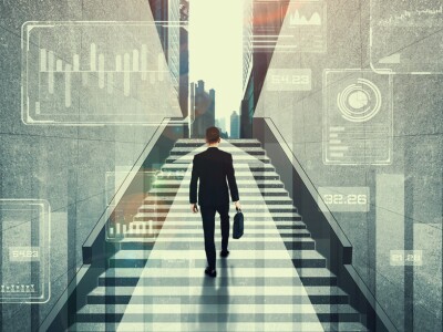 Businessman walking up steps with date analytics graphics surrounding him.
