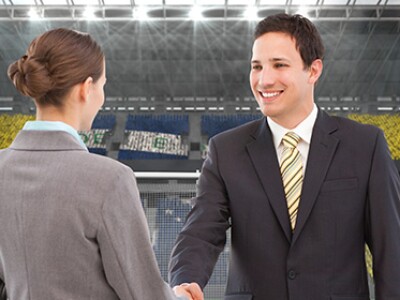 2 executives in a sports arena