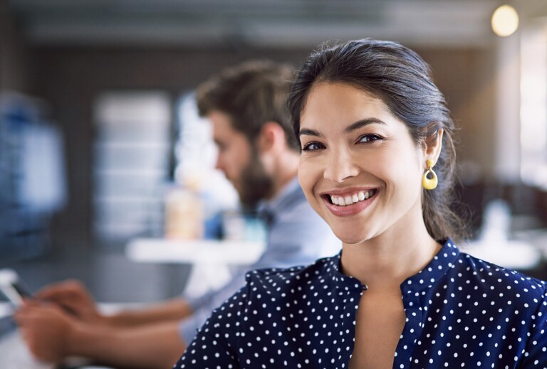 Woman smiling while in office