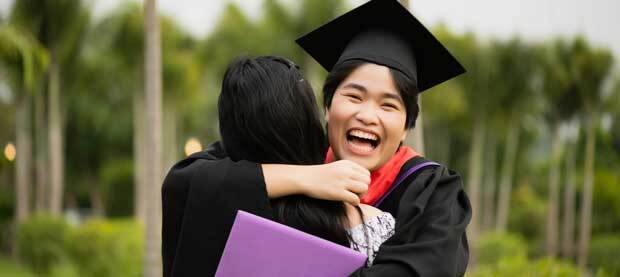 graduating-student-celebrating-with-a-hug