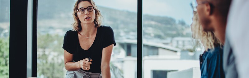 CMO addressing her team at a meeting