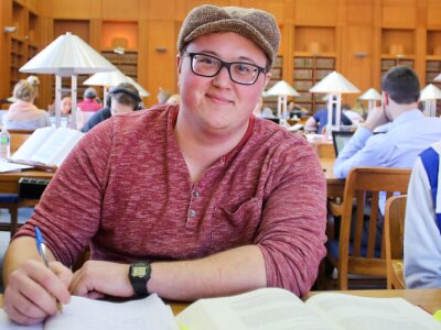 A diverse group of Tulane Law students studying in the campus library.