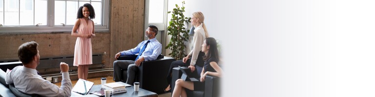 three professionally dressed students smiling