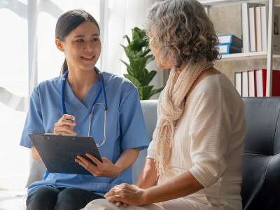 Nurse discussing care with a patient.