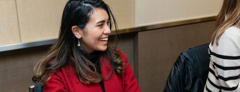woman smiling at her colleagues
