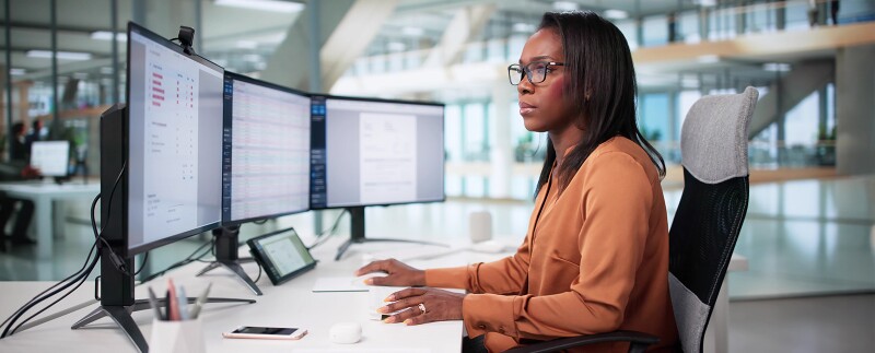 Health data analyst reviewing epidemiology charts and graphs