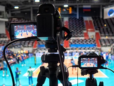 Digital camera filming sporting event as part of a sports media job
