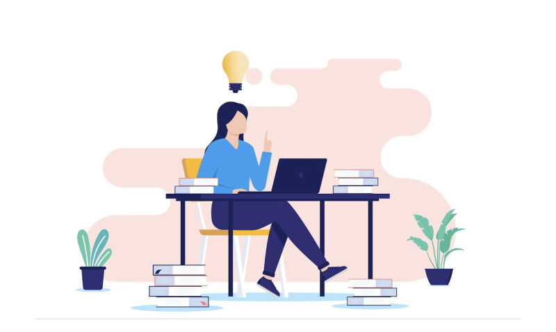 A person sitting at a desk using a laptop.