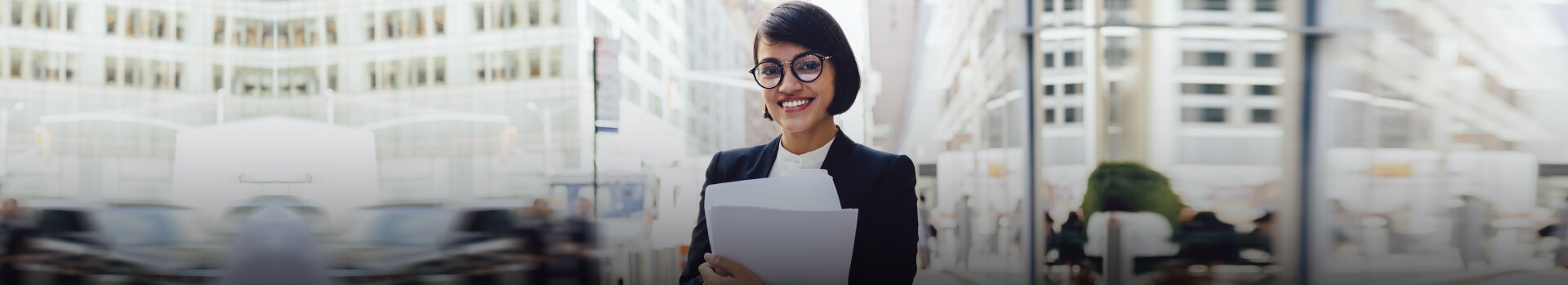 Female professional stands on New York City street