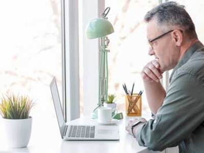 man-with-glasses-learning-on-a-computer