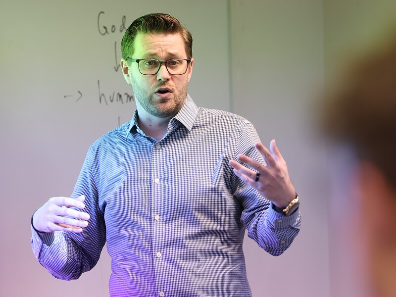 Professor speaking and gesturing