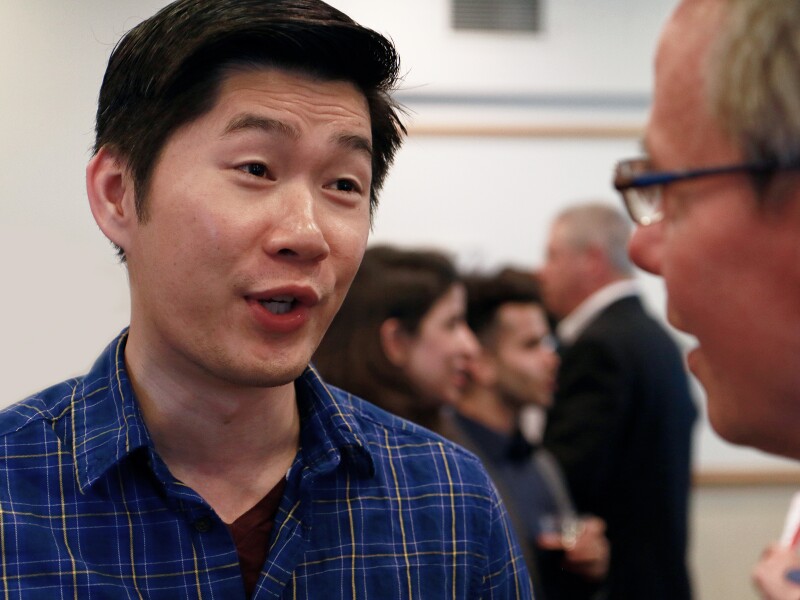 Two men talking at a Seattle University networking event