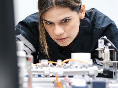 Modern people training in industry 4.0 automated engineering workshop.