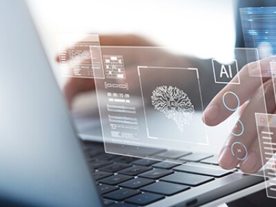 Person at keyboard using AI tools for business