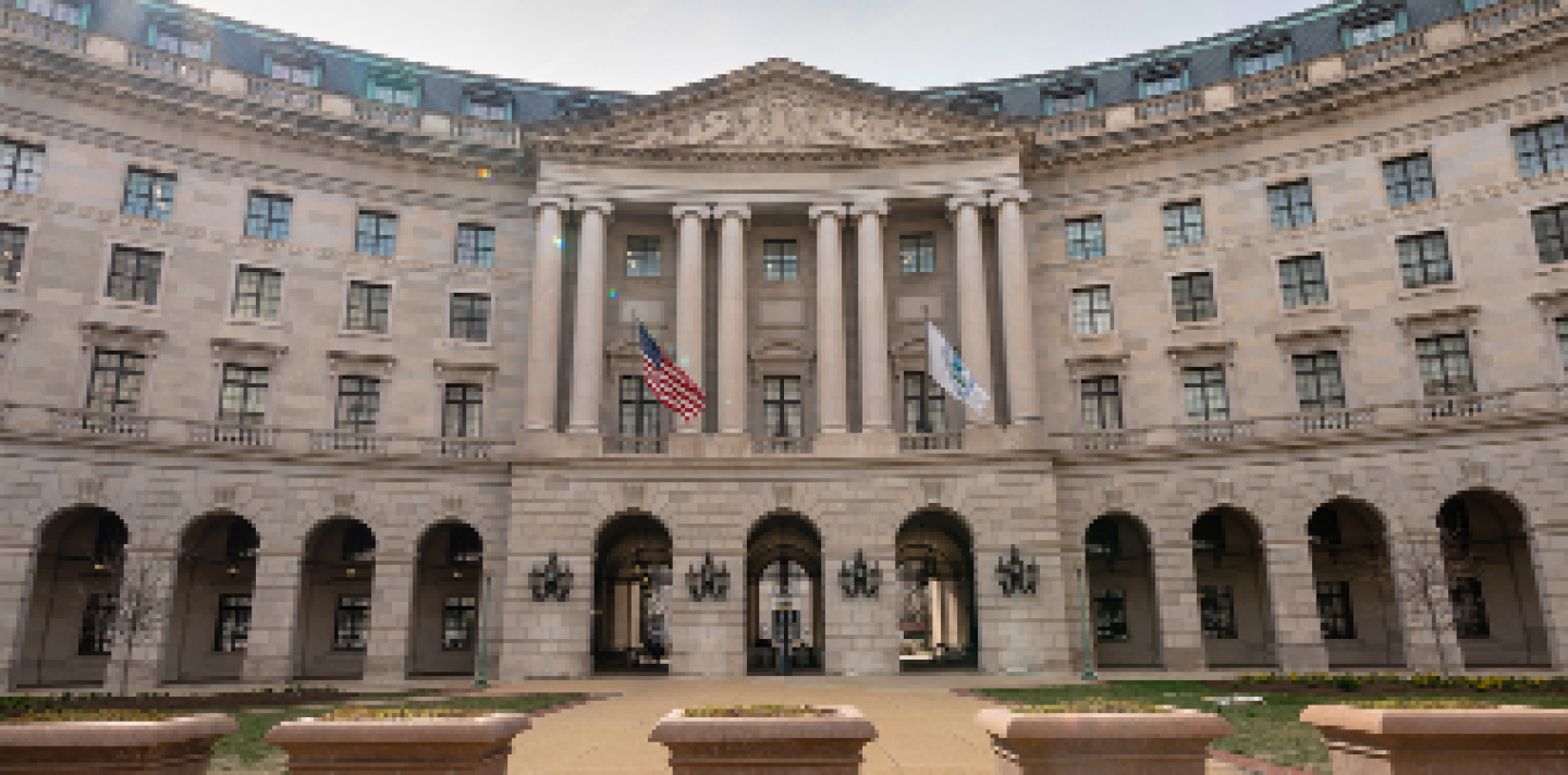 front view of a building with columns and archways